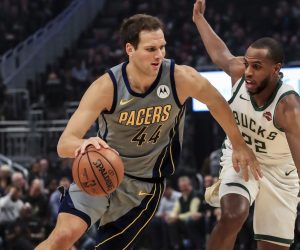 epa07421200 Indiana Pacers forward Bojan Bogdanovic of Croatia (L) drives around Milwaukee Bucks forward Khris Middleton (R) during the NBA game between the Indiana Pacers and the Milwaukee Bucks at Fiserv Forum in Milwaukee, Wisconsin, USA, 07 March 2019.  EPA/TANNEN MAURY  SHUTTERSTOCK OUT