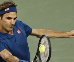 epa07432777 Roger Federer of Switzerland in action against Stan Wawrinka of Switzerland during the BNP Paribas Open tennis tournament at the Indian Wells Tennis Garden in Indian Wells, California, USA, 12 March 2019. The men's and women's final will be played, 17 March 2019.  EPA/LARRY W. SMITH