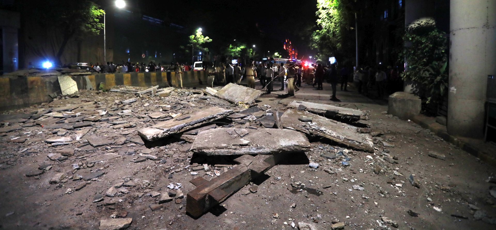 epa07436806 A general view of the partly collapsed foot over bridge adjacent to Chhtrapati Shivaji Maharaj Terminus railway station, in Mumbai, India, 14 March 2019. According to initial reports, three people were killed and more than 30 others injured in the incident.  EPA/DIVYAKANT SOLANKI