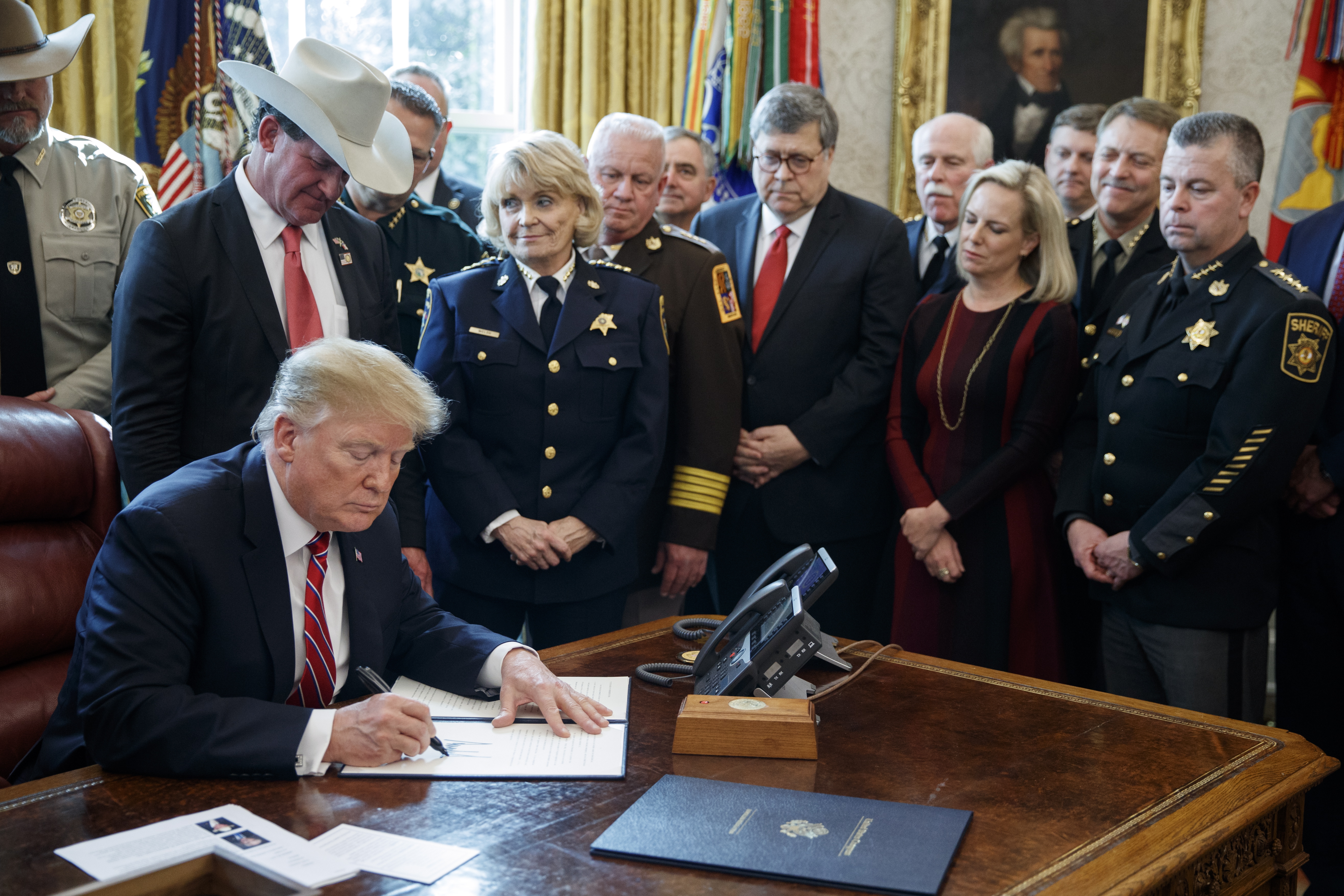 epa07440790 US President Donald J. Trump delivers remarks on the national security and humanitarian crisis on the southern border and vetoes the legislation that strikes down his national emergency declaration at the southern border a ceremony in the Oval Office of the White House in Washington, DC, USA, 15 March 2019. President Trump's veto, his first, sends the resolution back to Congress where it will require a 2/3 vote in each house to overturn.  EPA/SHAWN THEW