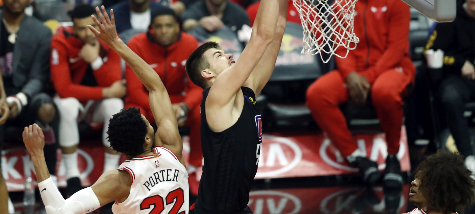epa07441193 Los Angeles Clippers center Ivica Zubac (R) of Croatia in action during the NBA basketball game between the Los Angels Clippers and the Chicago Bulls at the Staples Center Stadium in Los Angeles, California, USA, 15 March 2019.  EPA/ETIENNE LAURENT SHUTTERSTOCK OUT