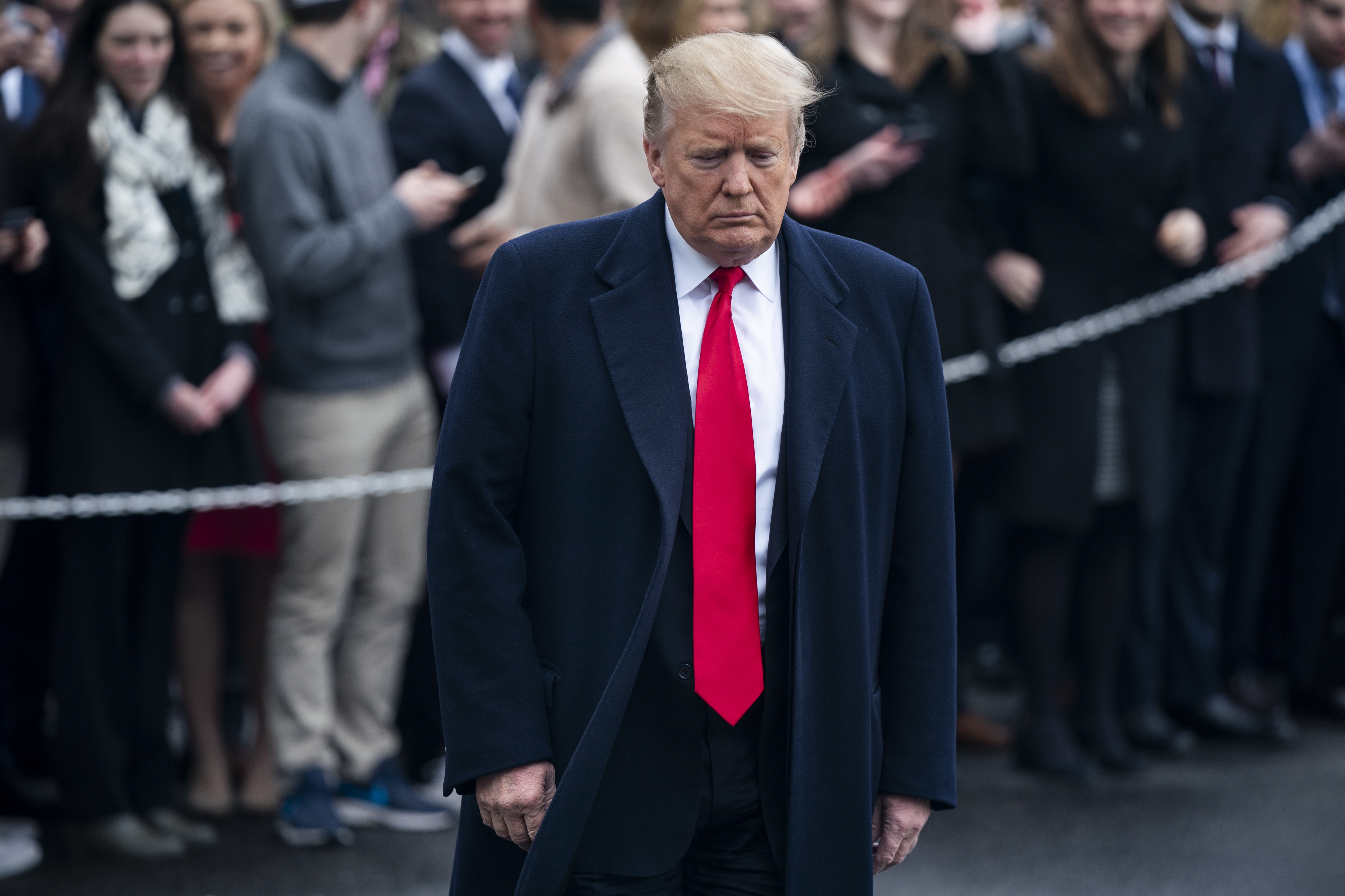 epa07455963 US President Donald J. Trump prepares to speak to the media as he departs the White House for his Mar-a-Lago resort in Washington, DC, USA, 22 March 2019. The Trump administration, along with lawmakers, are awaiting the release of special counsel Robert Mueller's report into President Trump's behavior.  EPA/JIM LO SCALZO