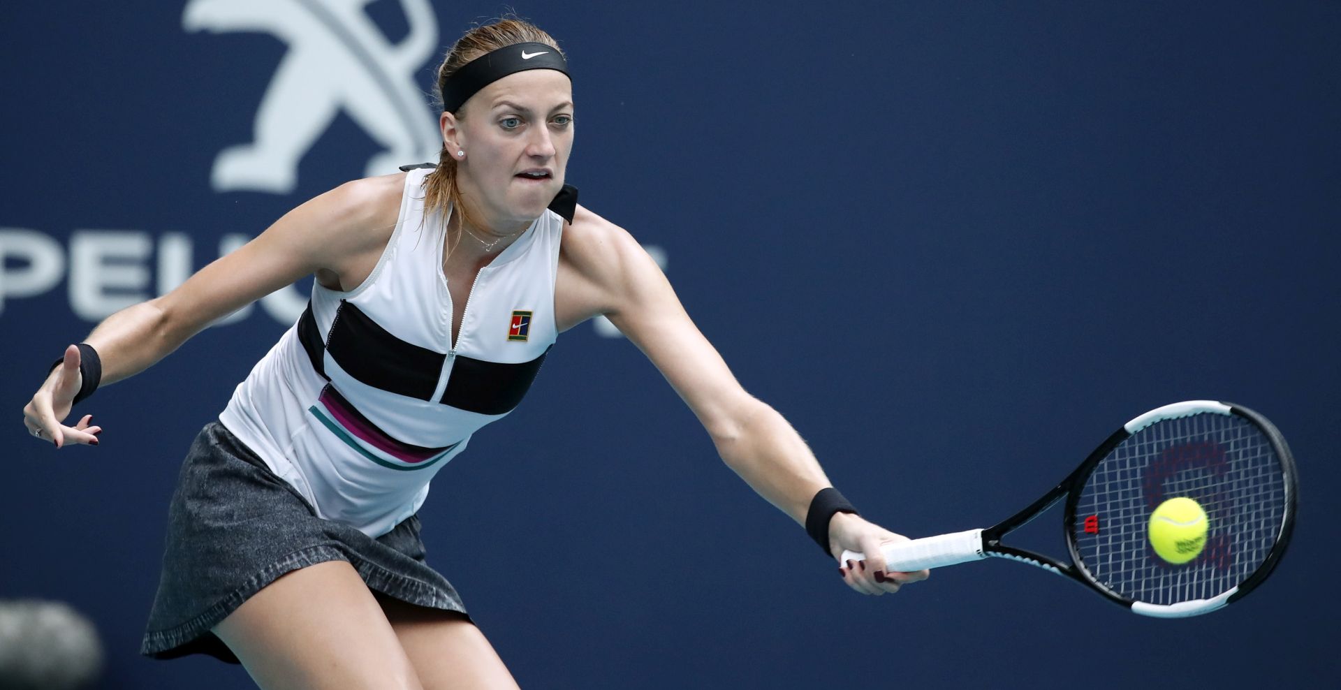 epa07463102 Petra Kvitova of the Czech Republic in action against Caroline Garcia of France during their women's singles match at the Miami Open tennis tournament in Miami, Florida, USA, 25 March 2019.  EPA/JASON SZENES