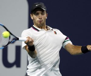 epa07467911 Borna Coric of Croatia in action against Felix Auger Aliassime of Canada during their men's singles match at the Miami Open tennis tournament in Miami, Florida, USA, 27 March 2019.  EPA/RHONA WISE