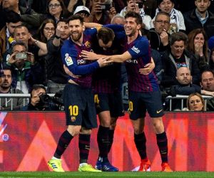 epa07409567 FC Barcelona's Ivan Rakitic (C) celebrates with teammate Leo Messi (L) and Sergi Roberto after scoring the 0-1 lead during a Spanish LaLiga soccer match between Real Madrid and FC Barcelona at the Santiago Bernabeu stadium in Madrid, Spain, 02 March 2019.  EPA/Rodrigo Jimenez