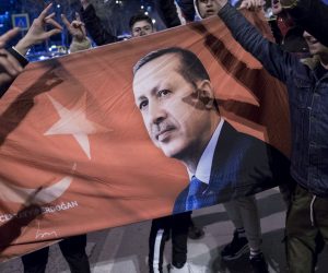 epa07477438 Supporters of Justice and Development Party (AK Party) with a banner with Turkish president Erdogan celebrate early results for Istanbul mayor in local election in Istanbul, Turkey, 31 March 2019. Some 57 milion people voted in local elections in Turkey's capital and the country's overall 81 provinces.  EPA/SEDAT SUNA