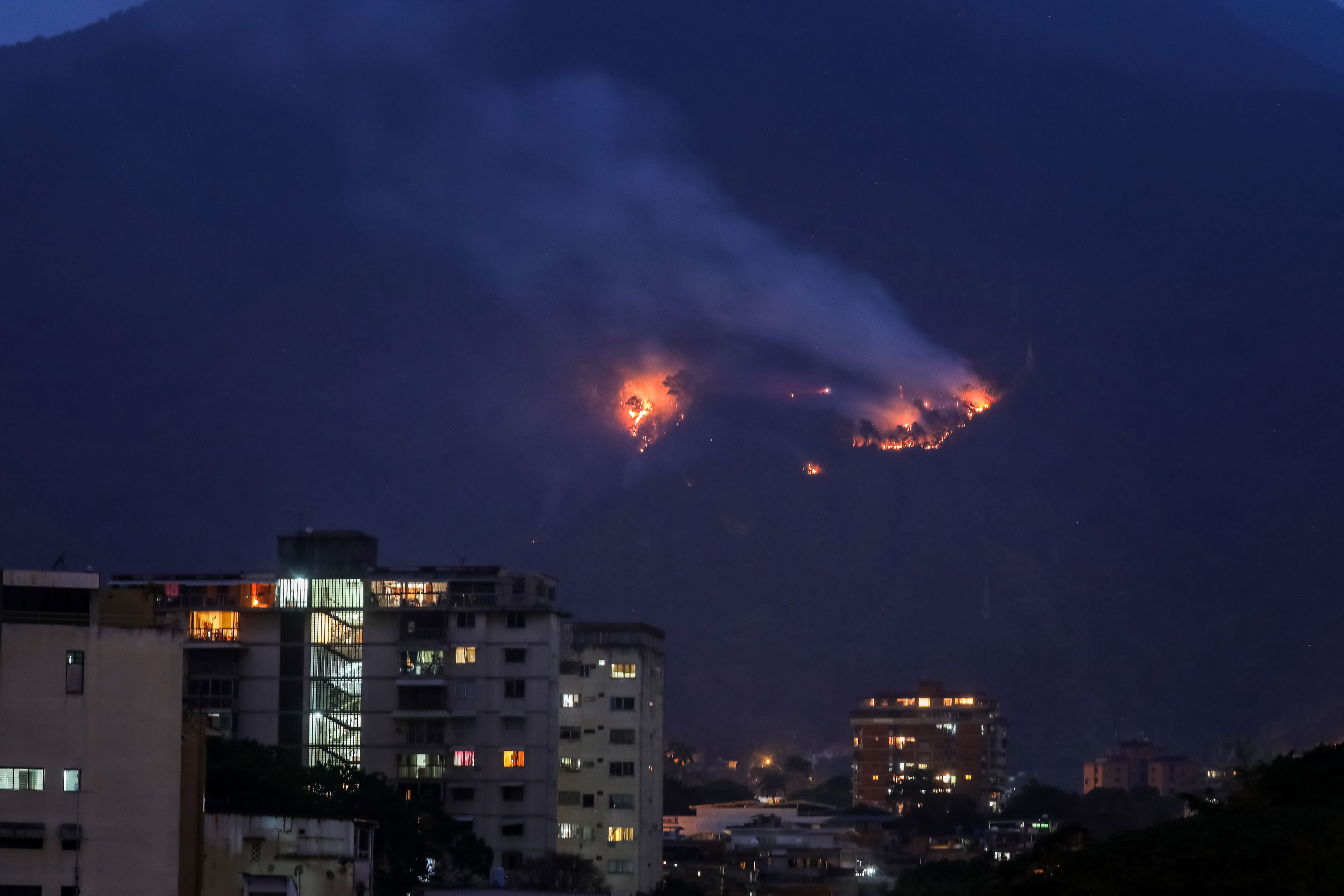 epa07477729 Partial view of 'El Avila' National Park during a fire near electric towers, in Caracas, Venezuela, 31 March 2019. The lack of water caused by a week of blackouts in Venezuela ended up pushing Venezuelans into the streets to protest against the government of Nicolas Maduro, resulting in clashes in Caracas with reports of gunfire. There were no imediate reports of injuries.  EPA/MIGUEL GUTIERREZ