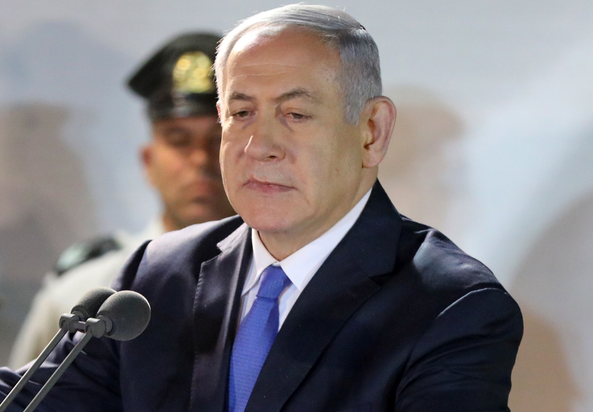epa07485221 Israeli Prime Minister Benjamin Netanyahu gives a speech during the funeral of Israeli Army Sergeant Zachary Baumel at the Mount Herzl military cemetery in Jerusalem, Israel, 04 April 2019. According to reports, joint efforts led by the Russian, Syrian and Israeli security forces led to the discovery of the remains of the missing soldier Zachary Baumel who was one of five soldiers missing since the Battle of Sultan Yacoub in 1982 against the Syrian army in Lebanon, during the First Lebanon war have been returned to his family and a burial in Israel.  EPA/ABIR SULTAN