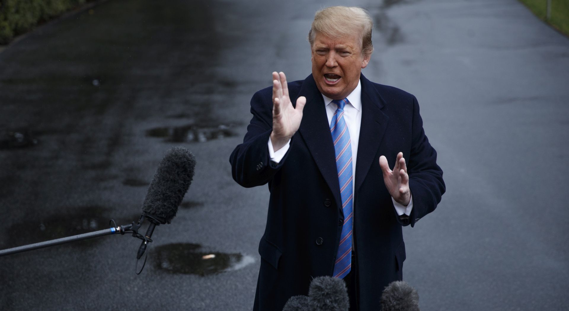 epa07486798 US President Donald J. Trump responds to a question from the news media as he walks to board Marine One on the South Lawn of the White House in Washington, DC, USA, 05 April 2019. President Trump will participate in a roundtable on immigration and border security then tour a section of new border wall.  EPA/SHAWN THEW