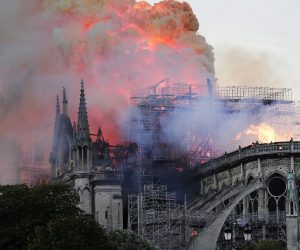 epa07508972 Flames on the roof of the Notre-Dame Cathedral in Paris, France, 15 April 2019. A fire started in the late afternoon in one of the most visited monuments of the French capital.  EPA/IAN LANGSDON
