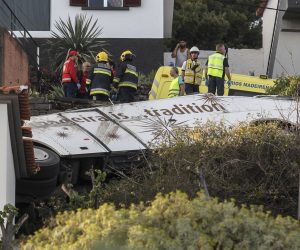 epa07512748 Emergency services inspect the scene of a tourist bus crash in Canico, Santa Cruz, Madeira Island, Portugal, 17 April 2019. According the Civil Protection of Madeira, several people died in the accident.  EPA/HOMEM GOUVEIA