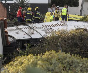 epa07512748 Emergency services inspect the scene of a tourist bus crash in Canico, Santa Cruz, Madeira Island, Portugal, 17 April 2019. According the Civil Protection of Madeira, several people died in the accident.  EPA/HOMEM GOUVEIA