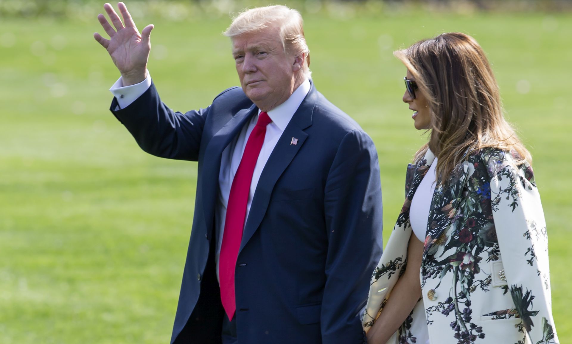 epa07514881 US President Donald J. Trump (L) and First Lady Melania Trump (R) walk on the South Lawn of the White House to Marine One in Washington, DC, USA, 18 April 2019. Trump was leaving to spend the long Easter Weekend at his Mar-a-Lago Club in Palm Beach, Florida. Trump did not stop to speak with the media, after a redacted version of Special Counsel Robert Mueller's report on Russian interference in the 2016 election was released earlier in the day.  EPA/ERIK S. LESSER