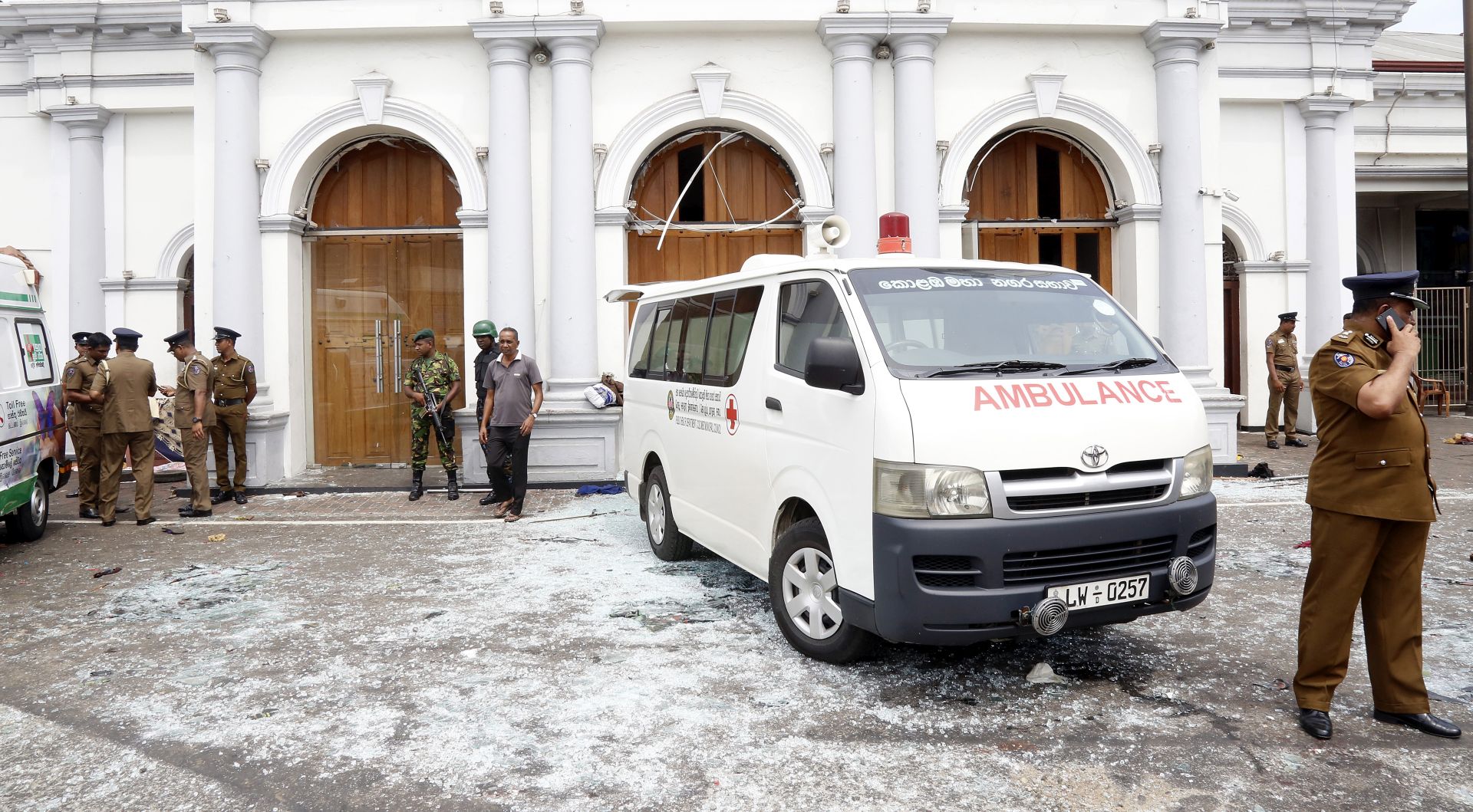 epa07518790 Police officers inspect the scene after a explosion hit at St Anthony's Church in Kochchikade in Colombo, Sri Lanka, 21 April 2019. According to the news reports at least 25 people killed and over 200 injured in a series of blasts during the Easter Sunday service at St Anthony's Church in Kochchikade and explosions also reported at the Shangri-La Hotel and Kingsbury Hotel.  EPA/M.A. PUSHPA KUMARA
