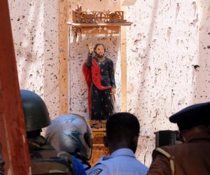 epa07519708 Police and locals inpect the damage and fatalaties in Katuwapitiya St. Sebastian church in Negombo near Colombo, Sri Lanka, 21 April 2019. According to police at least 207 people were more than 400 injured in a coordinated series of blasts during the Easter Sunday service at churches and hotels.  EPA/STR