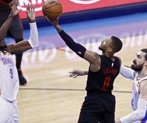 epa07520848 Portland Trail Blazers player Damian Lillard (C) goes to the basket against Oklahoma City Thunder players Steven Adams (R) and Jerami Grant (L) during the NBA Western Conference Playoffs basketball game four between the Portland Trail Blazers and Oklahoma City Thunder at the Chesapeake Energy Arena in Oklahoma City, Oklahoma, USA, 21 April 2019.  EPA/LARRY W. SMITH SHUTTERSTOCK OUT