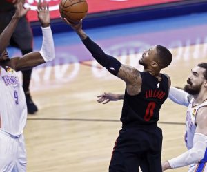 epa07520848 Portland Trail Blazers player Damian Lillard (C) goes to the basket against Oklahoma City Thunder players Steven Adams (R) and Jerami Grant (L) during the NBA Western Conference Playoffs basketball game four between the Portland Trail Blazers and Oklahoma City Thunder at the Chesapeake Energy Arena in Oklahoma City, Oklahoma, USA, 21 April 2019.  EPA/LARRY W. SMITH SHUTTERSTOCK OUT