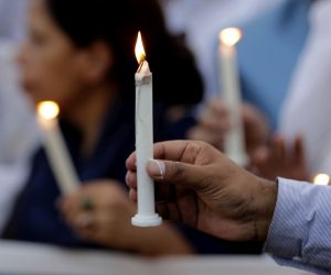 epa07521500 Pakistani activists of civil society light candles to commemorate the victims of the Sri Lanka bombings  in Lahore, Pakistan, 22 April 2019. According to police at least 290 people were killed and more than 400 injured in a coordinated series of blasts during the Easter Sunday service at churches and hotels in Sri Lanka on 21 April 2019.  EPA/RAHAT DAR