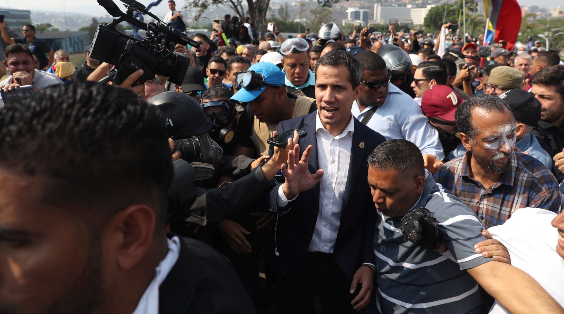 epa07538290 President of the Venezuelan Parliament Juan Guaido (c) participate in a demonstration in Caracas, Venezuela, 30 April 2019. Reports state that at least one person was injured during the clashes at La Carlota after Guaido called for mass anti-government protests backed by the military. Venezuelan interim President Juan Guaido has asked supporters to take to the streets in order to end the regime of President Nicolas Maduro. Meanwhile, Venezuelan opposition leader Leopoldo Lopez was freed from his house arrest, appearing alongside Guaido and military forces in Caracas.  EPA/Miguel Gutierrez