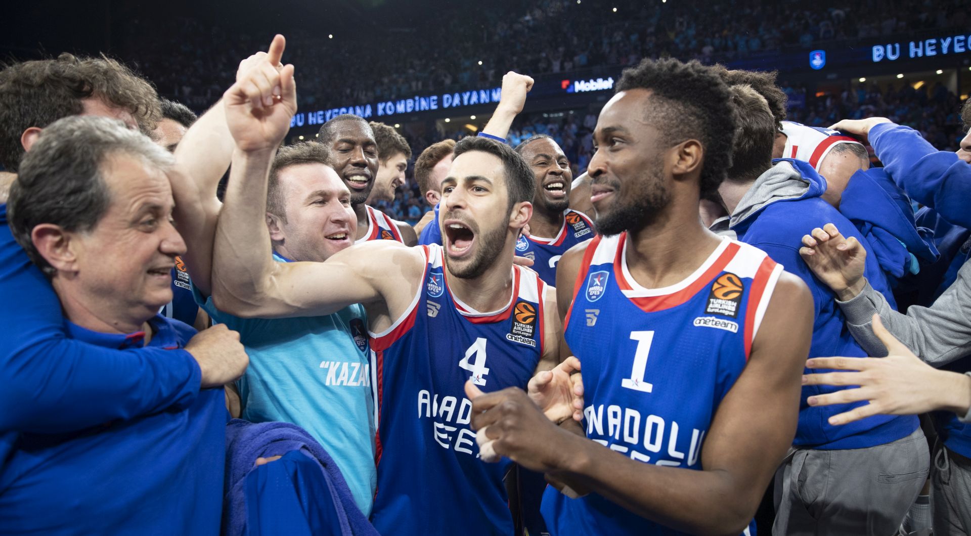 epa07541146 Anadolu Efes' Rodrigue Beaubois (R) and Dogus Balbay (C) and players celebrate after winning against Barcelona at the Euroleague play offs basketball match between Anadolu Efes and Barcelona in Istanbul, Turkey 01 May 2019.  EPA/TOLGA BOZOGLU