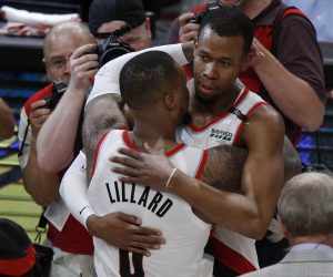 epa07546077 Portland Trail Blazers guard Damian Lillard (L) congratulates teammate Portland Trail Blazers guard Rodney Hood (R) after a four overtime Western Conference second round playoff game three between the Denver Nuggets and the Portland Trail Blazers at the Moda center in Portland, Oregon, USA, 03 May 2019.  EPA/STEVE DIPAOLA  SHUTTERSTOCK OUT