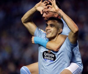 epa07547557 Celta de Vigo's Maxi Gomez (bottom) celebrates after scoring during a Spanish LaLiga soccer match between Celta de Vigo and FC Barcelona in Vigo, Galicia, northern Spain, 04 May 2019.  EPA/ELISEO TRIGO