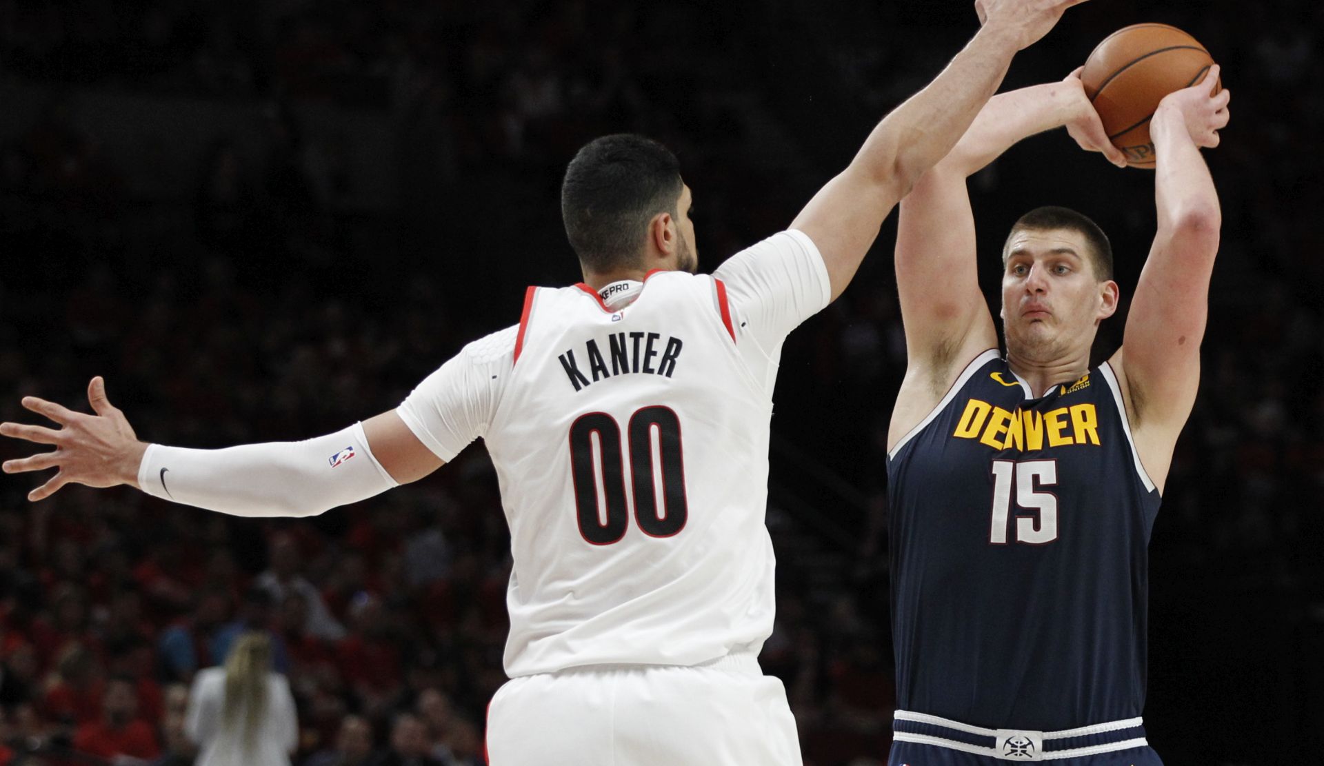 epa07550204 Denver Nuggets center Nikola Jokic (R) of Serbia looks to pass as Portland Trail Blazers center Enes Kanter (L) of Turkey defends during the NBA Western Conference second round playoff basketball game four between the Denver Nuggets and the Portland Trail Blazers at the Moda Center in Portland, Oregon, USA, 05 May 2019.  EPA/STEVE DIPAOLA  SHUTTERSTOCK OUT