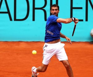 epa07551396 Marin Cilic of Croatia in action against Martin Klizan of Slovakia during their first round match of the Mutua Madrid Open tennis tournament at the Caja Magica complex in Madrid, Spain, 06 May 2019.  EPA/KIKO HUESCA