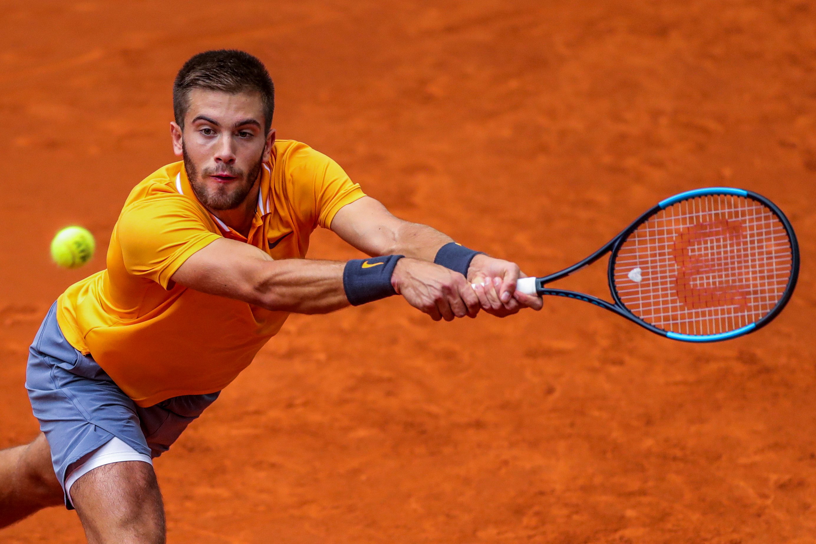 epa07554210 Croatia's Borna Coric in action during his first round match against French player Lucas Pouille at the Mutua Madrid Open tennis tournament in Madrid, Spain, 07 May 2019.  EPA/JUANJO MARTIN