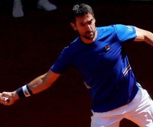 epa07557707 Marin Cilic of Croatia in action against Laslo Djere of Serbia during their third round match of the Mutua Madrid Open tennis tournament at the Caja Magica complex in Madrid, Spain, 09 May 2019.  EPA/CHEMA MOYA