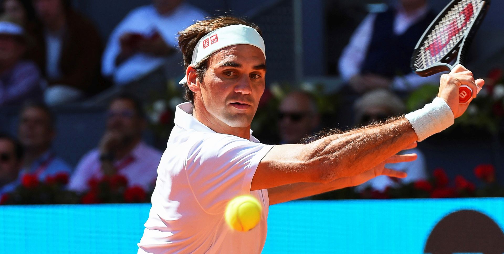 epa07558399 Roger Federer of Switzerland in action against Gael Monfils of France during their third round match of the Mutua Madrid Open tennis tournament at the Caja Magica complex in Madrid, Spain, 09 May 2019.  EPA/FERNANDO VILLAR