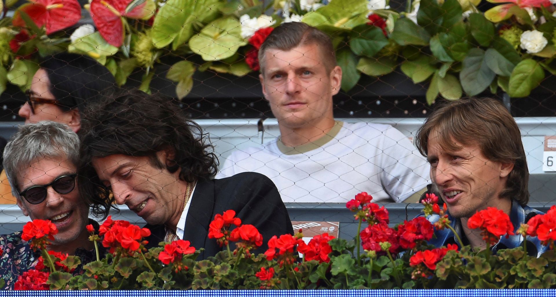epa07558841 Real Madrid's players Toni Kroos (2-R) and Luka Modric (R) observe the Mutua Madrid Open's tennis tournament match between Stan Wawrinka and Kei Nishikori at Caja Magica tennis complex, in Madrid, Spain, 09 May 2019.  EPA/FERNANDO VILLAR