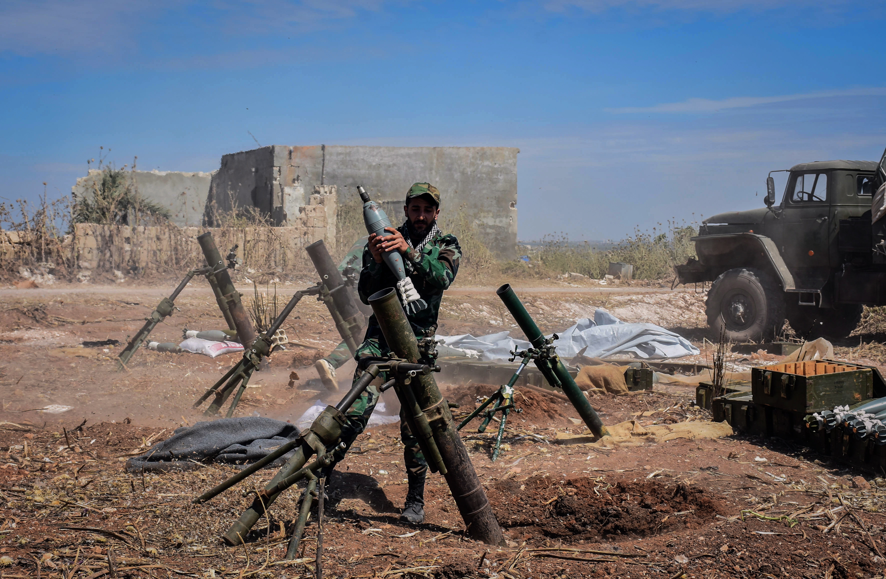 epa07563357 A handout photo made available by the Syrian Arab News Agency (SANA), shows a Syrian army soldier prepares to target terrorists' area, during an operation to liberate the village of Kafar Naboudeh, in Hama, Syria, 11 May 2019. According to SANA, the liberation of the town was achieved following precise and accurate operations targeting the terrorists' positions in the town, paving the way for expanding the secure area in Hama's northern countryside to include al-Bana, al-Arima, Tel Othman, Qalaat al-Madiq, and Bab al-Taqa.  EPA/SANA HANDOUT  HANDOUT EDITORIAL USE ONLY/NO SALES