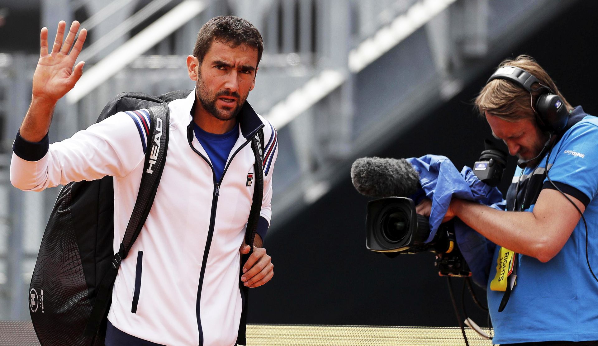 epa07569892 Marin Cilic (L) of Croatia arrives for his men's singles first round match against Andrea Basso of Italy at the Italian Open tennis tournament in Rome, Italy, 14 May 2019.  EPA/RICCARDO ANTIMIANI