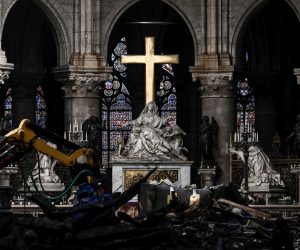 epa07572825 A picture shows rubble and the cross at the altar inside the the Notre Dame de Paris Cathedral after it sustained major fire damage the previous month, during a visit by the Canadian prime minister in Paris France, 15 May 2019. On 15 April, fire destroyed the roof and steeple of the 850-year-old Gothic cathedral. Images of the ancient cathedral going up in flames sparked shock and dismay across the globe as well as in France, where it is considered one of the nation's most beloved landmarks.  EPA/PHILIPPE LOPEZ  MAXPPP OUT