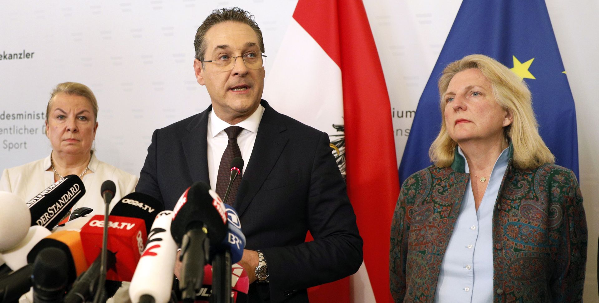 epa07580344 Austria's Vice-Chancellor Heinz Christian Strache (C) of the Austrian Freedom Party (FPOe) gives a statement to the journalists as Labour Minister Beate Hartinger-Klein (L) and Foreign Minister Karin Kneissl (R) listen in the Ministry of Public Service and Sport in Vienna, Austria, 18 May 2019. Austrian Vice Chancellor Strache on 18 May 2019 said he will step down from his post as media caught the far-right FPOe's leader Strache in a corruption allegations scandal. German media have on 17 May 2019 published a secretly recorded video of Strache in Ibiza in July 2017, where Heinz-Christian Strache is claimed to meet an alleged niece of a unknown Russian oligarch who wanted to invest large sums of money in Austria.  EPA/FLORIAN WIESER