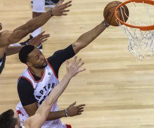epa07585770 Toronto Raptors forward Norman Powell (R) goes to the basket between Milwaukee Bucks forward Giannis Antetokounmpo (L) of Greece and guard Pat Connaughton (L, bottom) in the first quarter of the NBA Eastern Conference Finals Game 3 basketball game between the Toronto Raptors and Milwaukee Bucks at Scotiabank Arena in Toronto, Canada, 19 May 2019.  EPA/WARREN TODA  SHUTTERSTOCK OUT