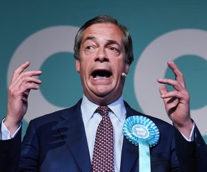 epa07590341 Brexit Party leader Nigel Farage delivers a speech to supporters during a rally at Olympia in London, Britain, 21 May 2019. EU elections are 23 May.  EPA/ANDY RAIN