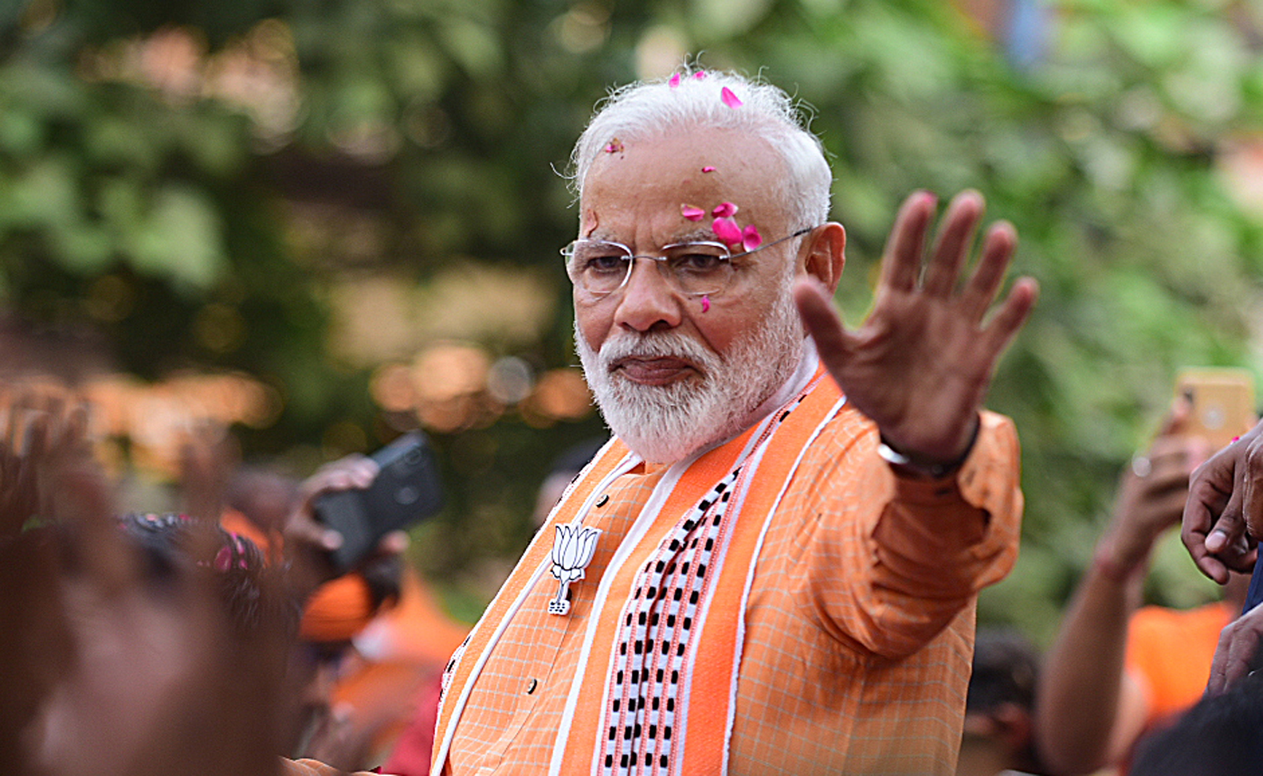 epa07594086 (FILE) - Top Bhartya Janta party (BJP) leader and Indian Prime Minister Narendra Modi waves to his supporters during a road show in Varanasi, Uttar Pradesh, India, 25 April 2019 (reissued 23 May 2019). According to reports, Modi's BJP party has won the Indian elections.  EPA/PRABHAT KUMAR VERMA