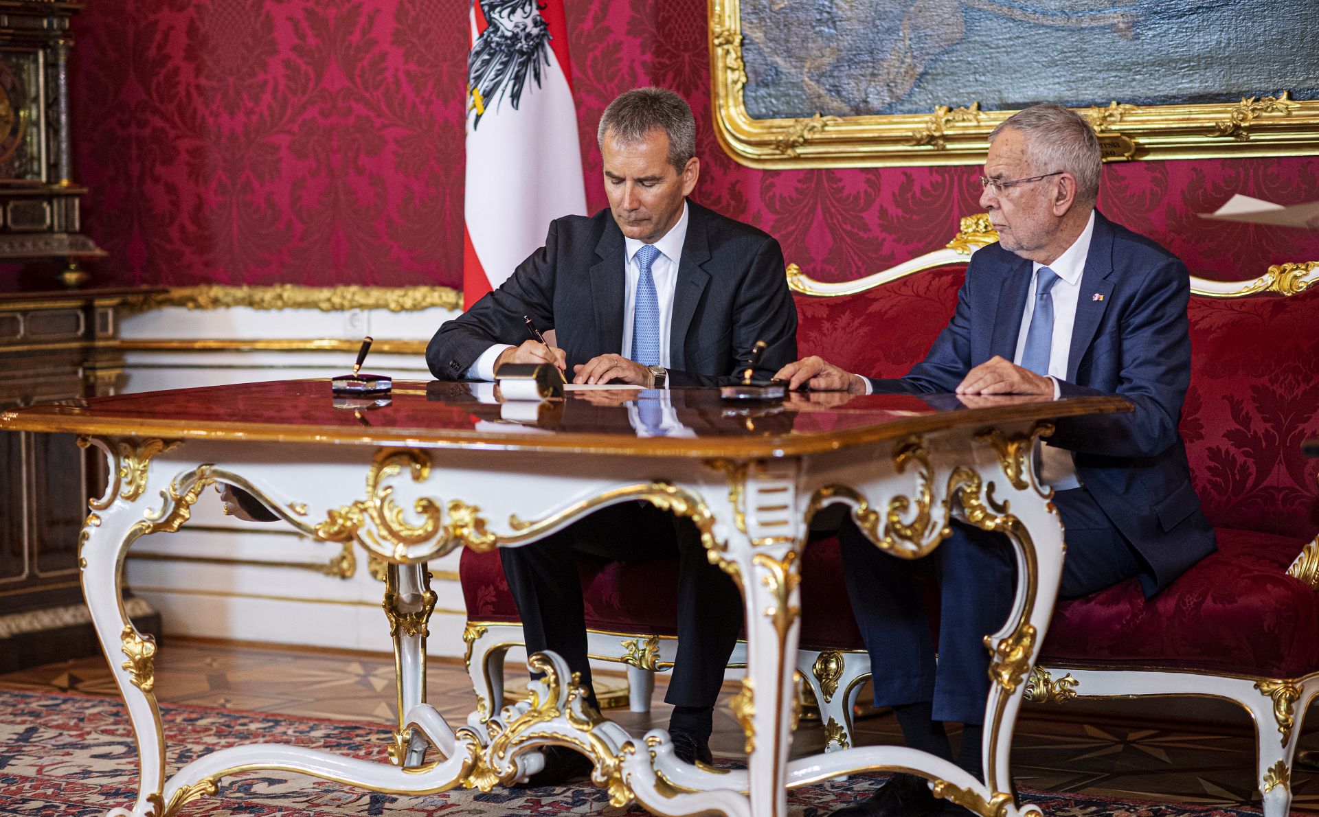 epa07607480 Austrian President Alexander Van der Bellen (R) deposing the government of ex-Chancellor Kurz and assigning the Chancellor Agenda and governmental Affairs to Vice Chancellor and Austrian Finance Minister Hartwig Loeger (L) at the Presidential residence in Vienna, Austria, 28 May 2019. The Austrian Chancellor and leader of the Austrian People's Party' (OeVP) lost a no-confidence vote in parliament on 27 May 2019 after his government's coalition partner, the far-right Freedom Party (FPOe) had come under fire over a secretly filmed video which appeared to show the FPOe leader and Vice-Chancellor promising public contracts in return for election campaign donations from a fake Russian backer.  EPA/CHRISTIAN BRUNA