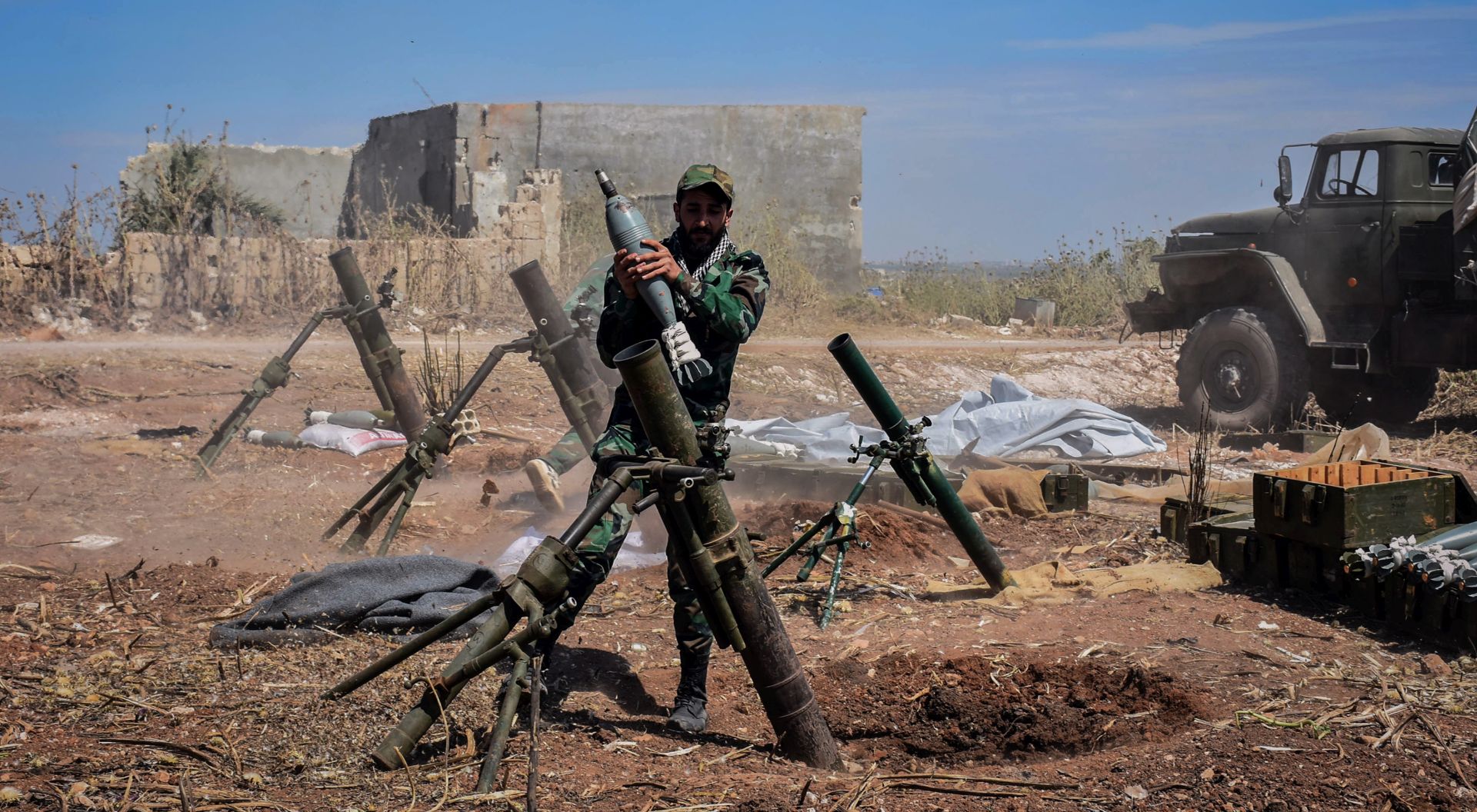 epa07563357 A handout photo made available by the Syrian Arab News Agency (SANA), shows a Syrian army soldier prepares to target terrorists' area, during an operation to liberate the village of Kafar Naboudeh, in Hama, Syria, 11 May 2019. According to SANA, the liberation of the town was achieved following precise and accurate operations targeting the terrorists' positions in the town, paving the way for expanding the secure area in Hama's northern countryside to include al-Bana, al-Arima, Tel Othman, Qalaat al-Madiq, and Bab al-Taqa.  EPA/SANA HANDOUT  HANDOUT EDITORIAL USE ONLY/NO SALES
