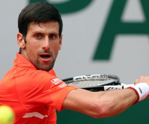 epa07612581 Novak Djokovic of Serbia plays Henri Laaksonen of Switzerland during their men’s second round match during the French Open tennis tournament at Roland Garros in Paris, France, 30 May 2019.  EPA/SRDJAN SUKI
