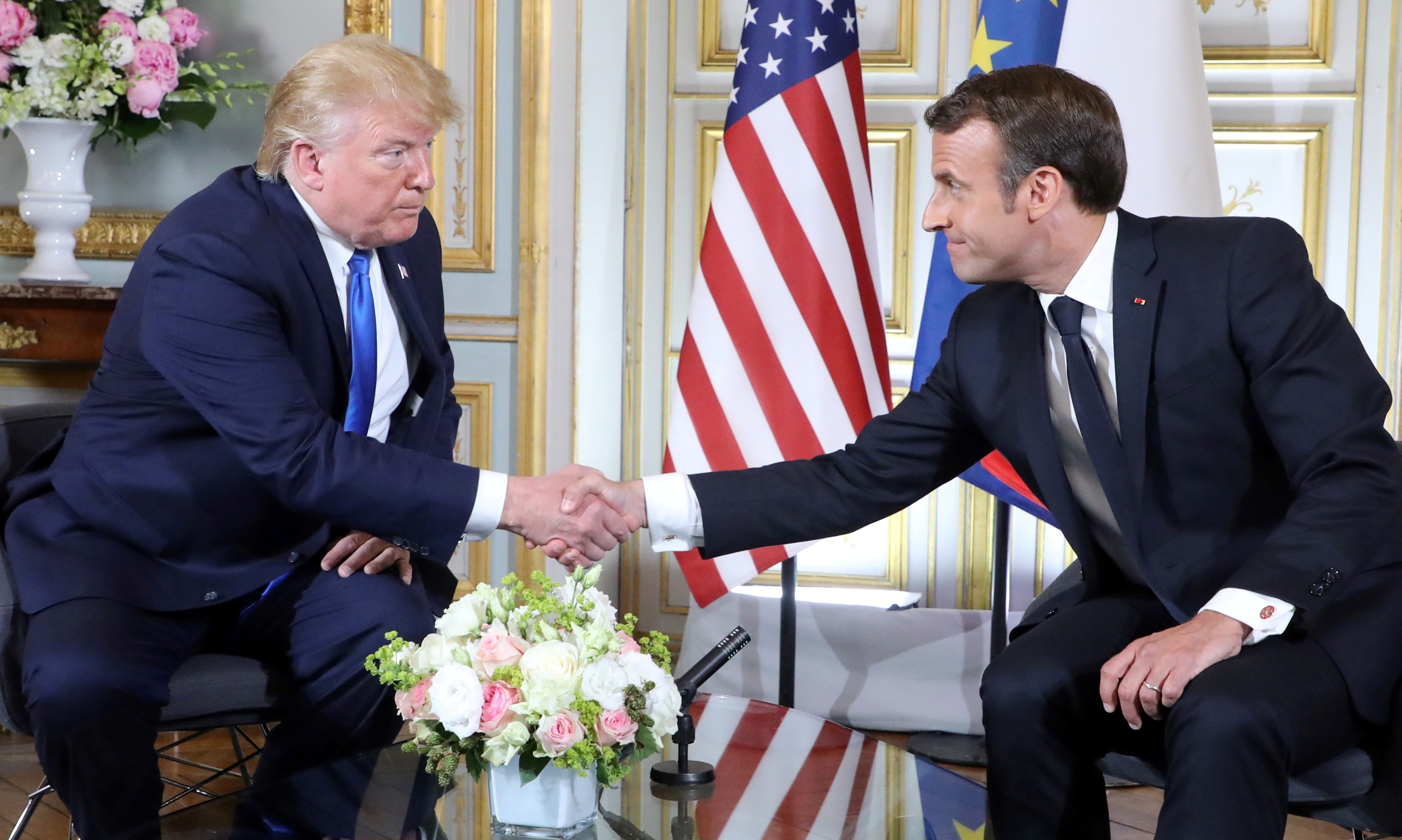 epa07630539 US President Donald J. Trump (L) and French President Emmanuel Macron (R) shake hands during a bilateral meeting on the sidelines of D-Day commemorations at the Prefecture of Caen, Normandy, France, 06 June 2019. World leaders are attending memorial events in Normandy, France to mark the 75th anniversary of the D-Day landings, which marked the beginning of the end of World War II in Europe.  EPA/LUDOVIC MARIN / POOL  MAXPPP OUT