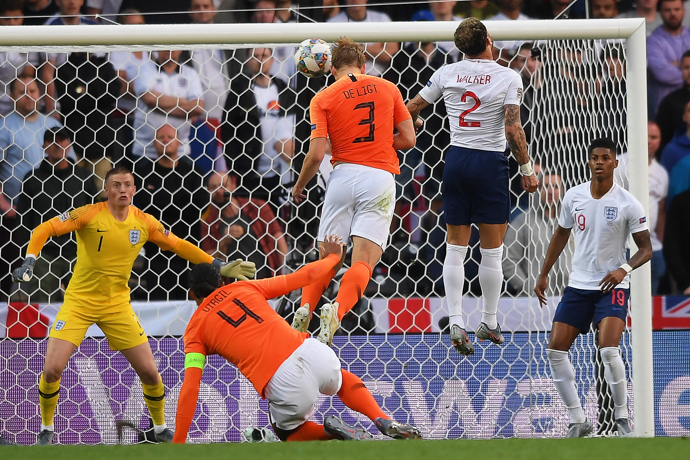 epa07631317 Matthijs de Ligt (C) of the Netherlands in action against England's Kyle Walker (2-R) during the UEFA Nations League semi final soccer match between the Netherlands and England at D. Afonso Henriques stadium in Guimaraes, Portugal, 06 June 2019.  EPA/HUGO DELGADO