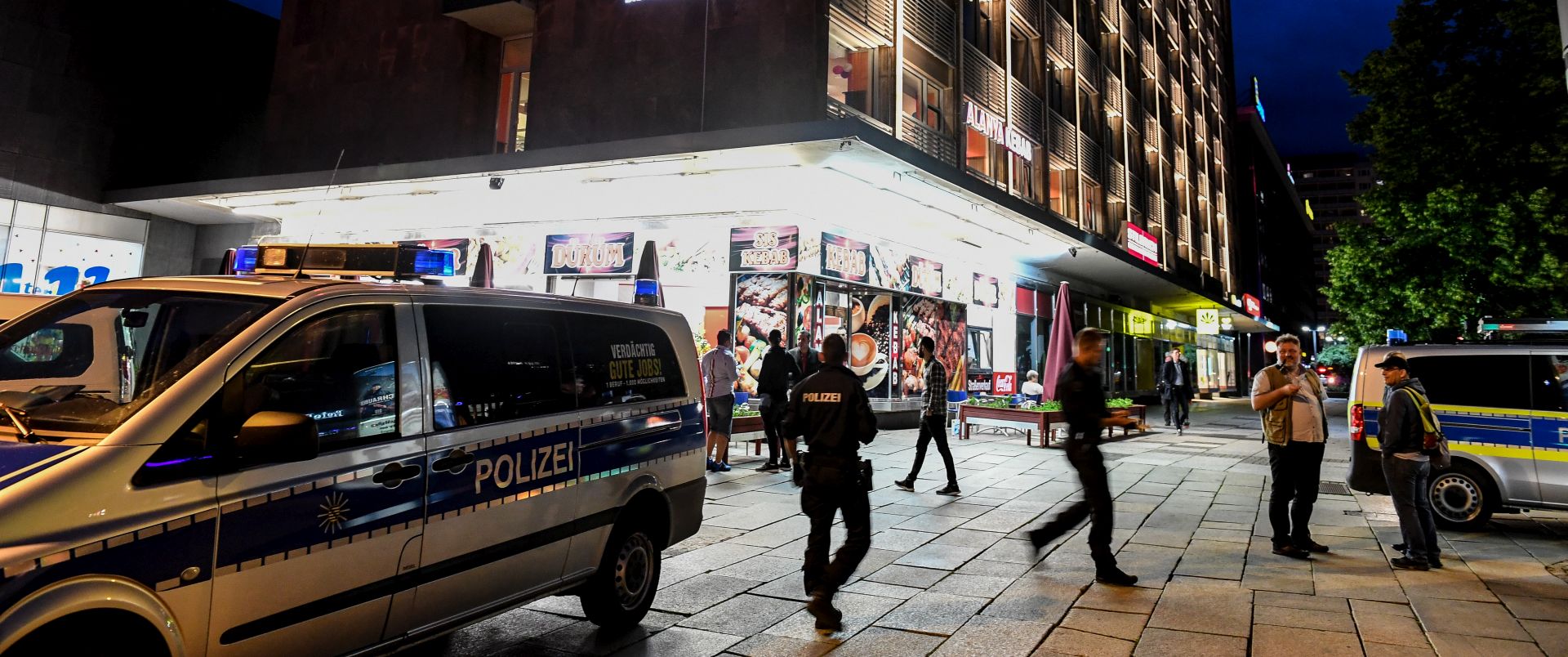 epa07644549 Police officers walks next to Alanya Kebab before the crime reenactment of the deadly stabbing attack, Chemnitz,  Germany, 12 June 2019. The asylum seeker Alaa S is accused of having killed 35-year-old Daniel H. in Chemnitz on 26 August 2018. After the killing neo-Nazis and right-wing groups demonstrated in Chemnitz leading to violent riots. The political discussion about hunts against foreigners during these demonstrations triggered a government crisis.  EPA/FILIP SINGER