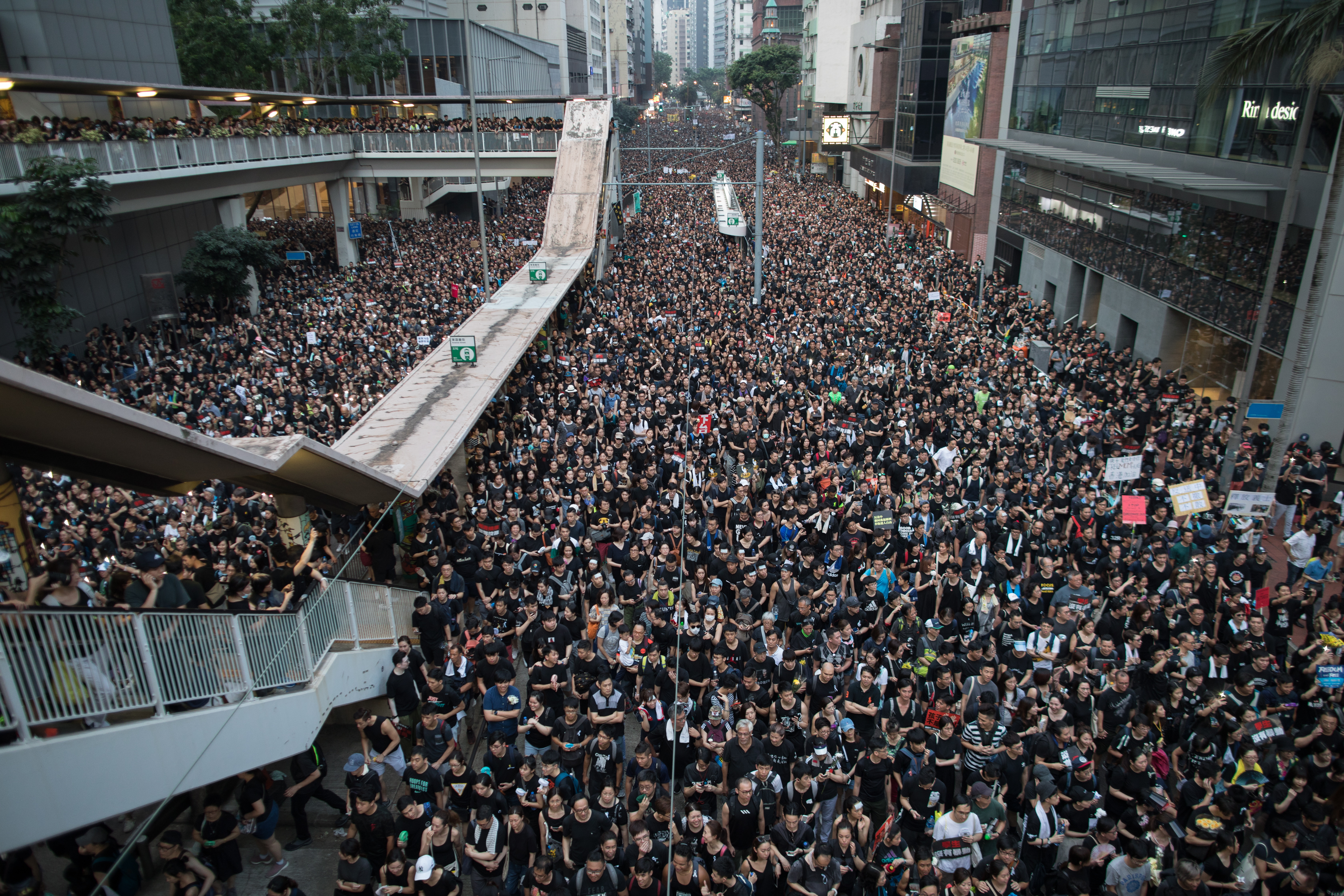 epa07651859 Protesters take part in a rally to demand a complete withdrawal of an extradition bill in Hong Kong, China, 16 June 2019. A day after Hong Kong Chief Executive Carrie Lam Cheng Yuet-ngor indefinitely suspended a bill that would have allowed extraditions to mainland China in the aftermath of violent clashes where riot police fired rubber bullets, tear gas and pepper spray at protesters, thousands took to the street asking for a complete withdrawal of the bill.  EPA/JEROME FAVRE