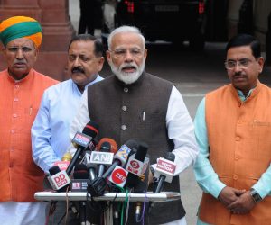 epa07653670 Indian Prime Minister Narendra Modi (2-R), addresses the media as he arrives for the first session of 17th Lok Sabha, at Parliament, in New Delhi, India, 17 June 2019. The first session of the Lok Sabha (the lower house of India's Parliament) was held in which the new lawmakers took the oath after Bharatiya Janata Party's (BJP) emphatic win in the recently held Lok Sabha elections.  EPA/STR