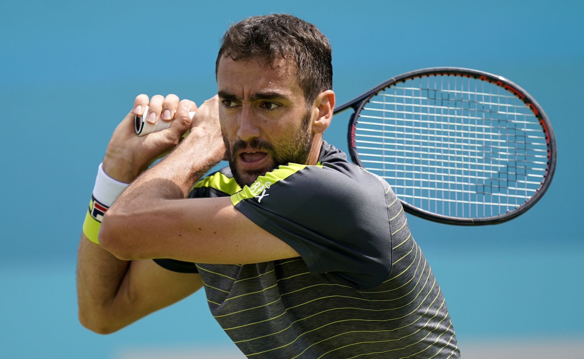 epa07654158 Croatia's Marin Cilic in action during his round of 32 match against Chile's Cristian Garin at the Fever Tree Championship at Queen's Club in London, Britain, 17 June 2019. The tournament runs from 17th June till 23 June 2019.  EPA/WILL OLIVER