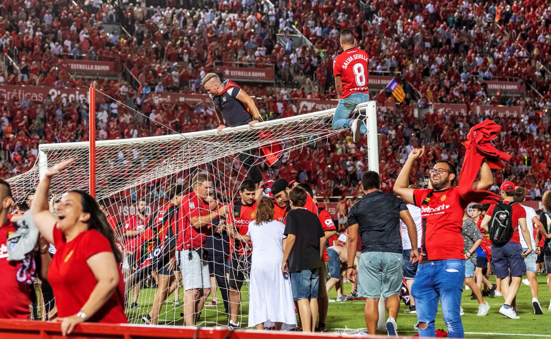 epa07669837 Mallorca FC fans celebrate the promotion of their team to first division after their victory against Deportivo de la Coruna in Palma de Mallorca, Spain, 23 June 2019 (issued 24 June 2019). Mallorca FC managed the promotion to the first division league after beating Deportivo de la.  EPA/CATI CLADERA