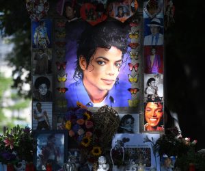 24 June 2019, Munich: Flowers, pictures and candles stand before the commemoration of the 10th anniversary of Michael Jackson's death at his monument at Promenadeplatz. Photo: Tobias Hase/dpa